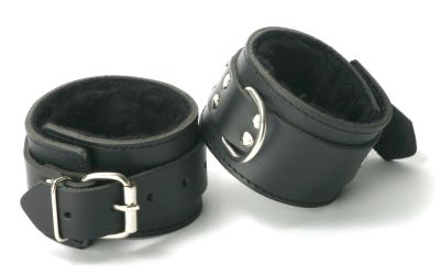 Plush faux fur lines the bottom of these Wrist and Ankle cuffs equaling a comfortable fit on a person's wrist or ankles. The cuff is durable and has a D-ring for attachment to other bondage gear.

Note: Sold in pairs of either wrist or ankle restraints.
